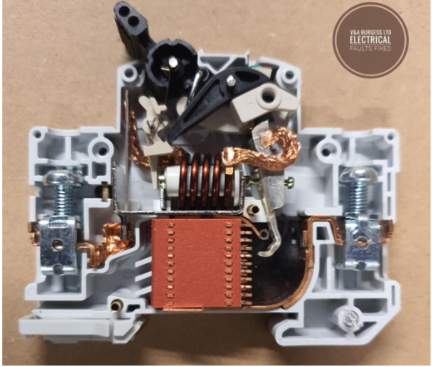 A miniature circuit breaker cut open to expose the workings - Electrical Faults Fixed