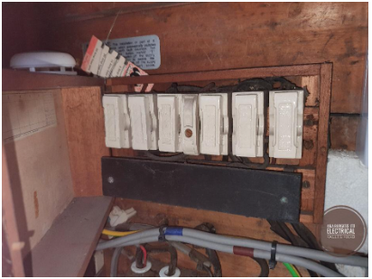 A 1930s wooden fuse box incapable of supplying EV equipment - Electrical Faults Fixed